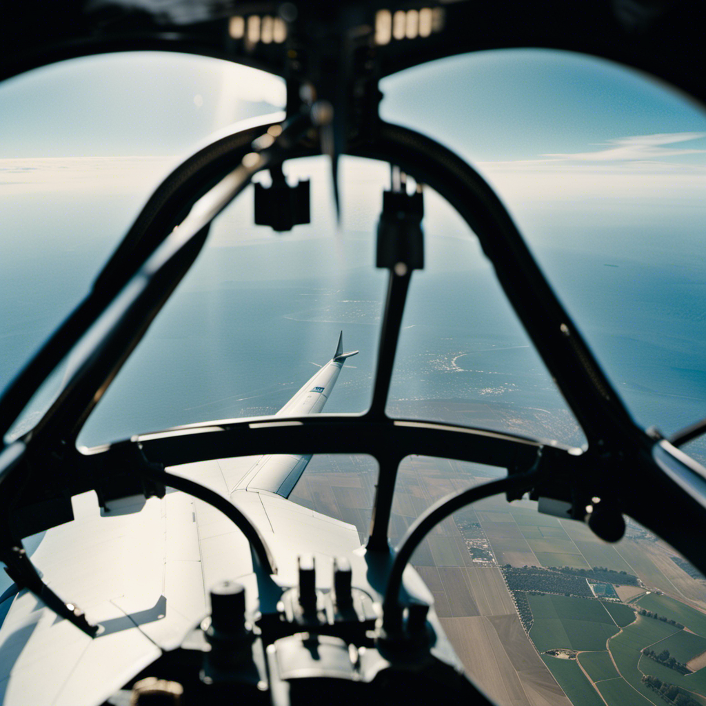 -up shot of a glider's cockpit window, revealing a clear view of the vast blue sky outside