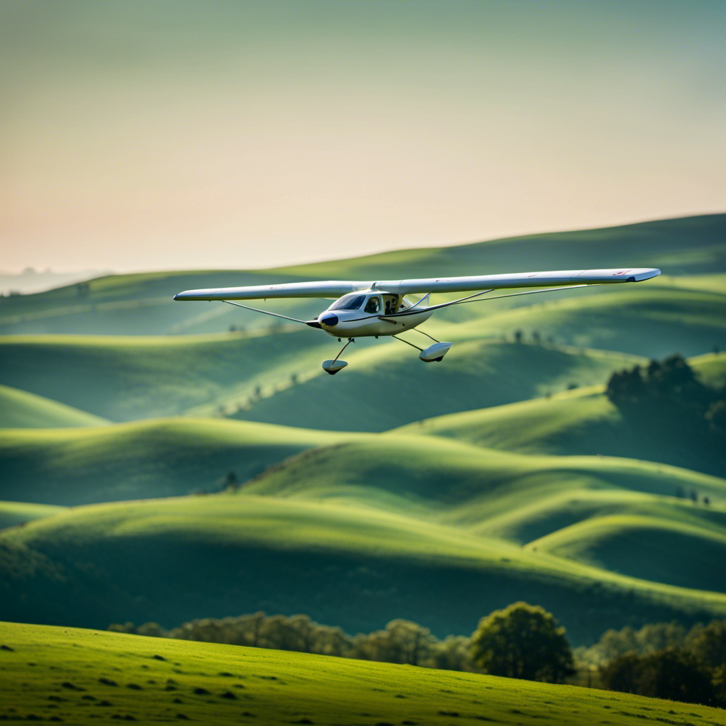An image capturing a picturesque landscape of rolling green hills with a clear blue sky above, showcasing a glider gracefully soaring through the air, its wingspan outstretched, as a beginner pilot confidently maneuvers the controls